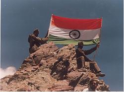Picture of Indian Soldiers displaying the tricolor after successfully capturing Tiger Hills. 26 July is celebrated as Vijay Diwas, to commemorate the victory in Operation Vijay